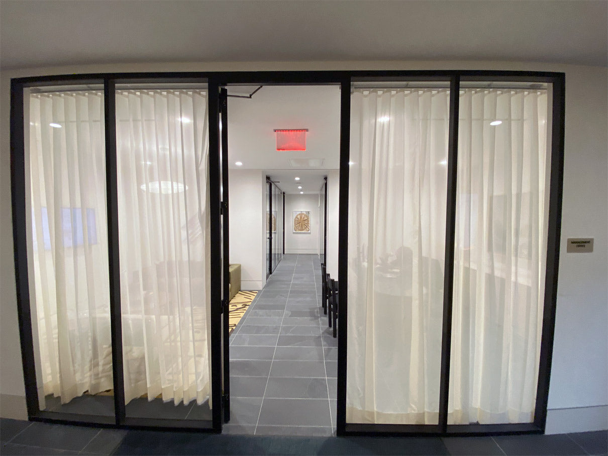 NxtWall FLEX black-frame glass office front with interior privacy curtains