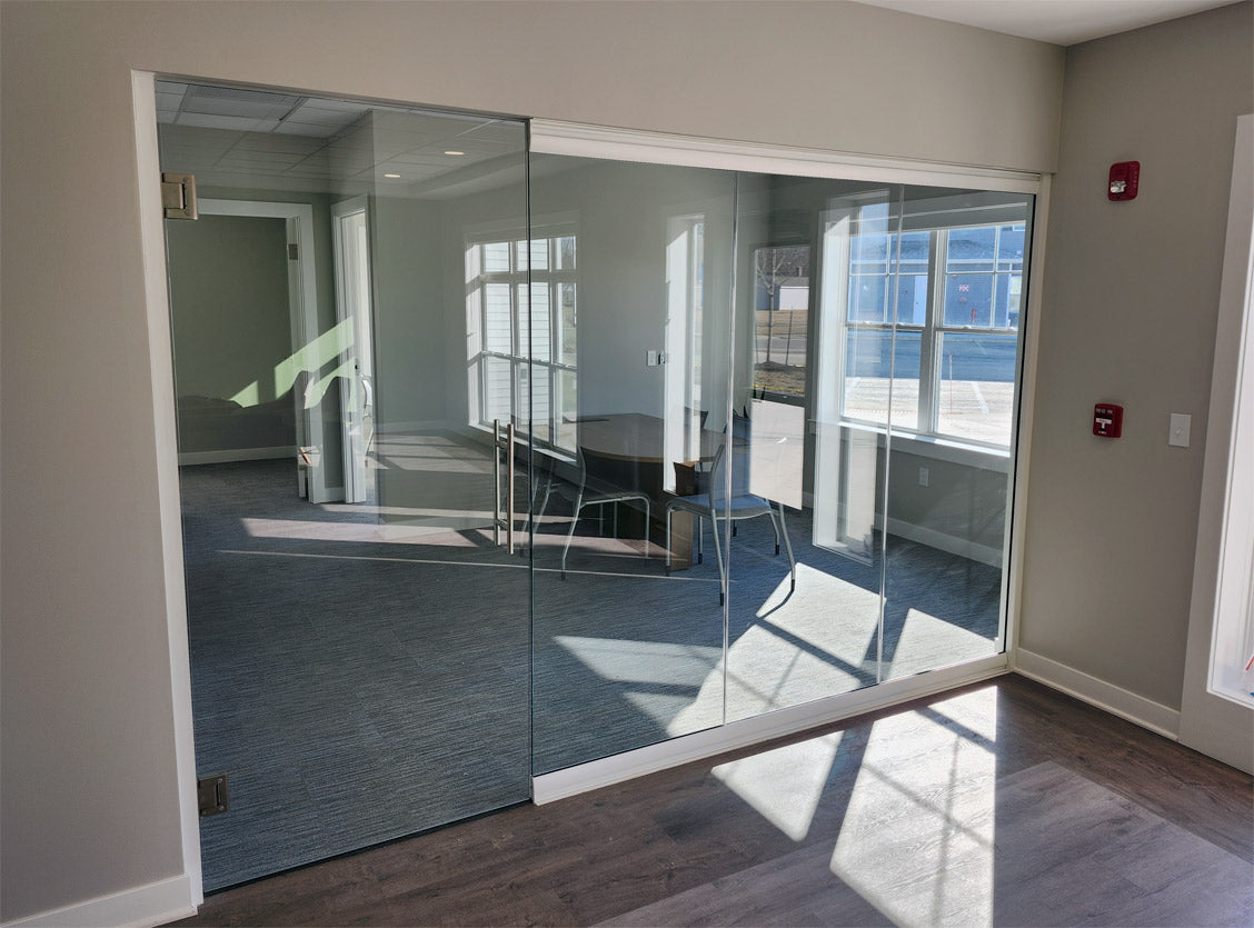 NxtWall View Series glass conference room with white frame and frameless swing door