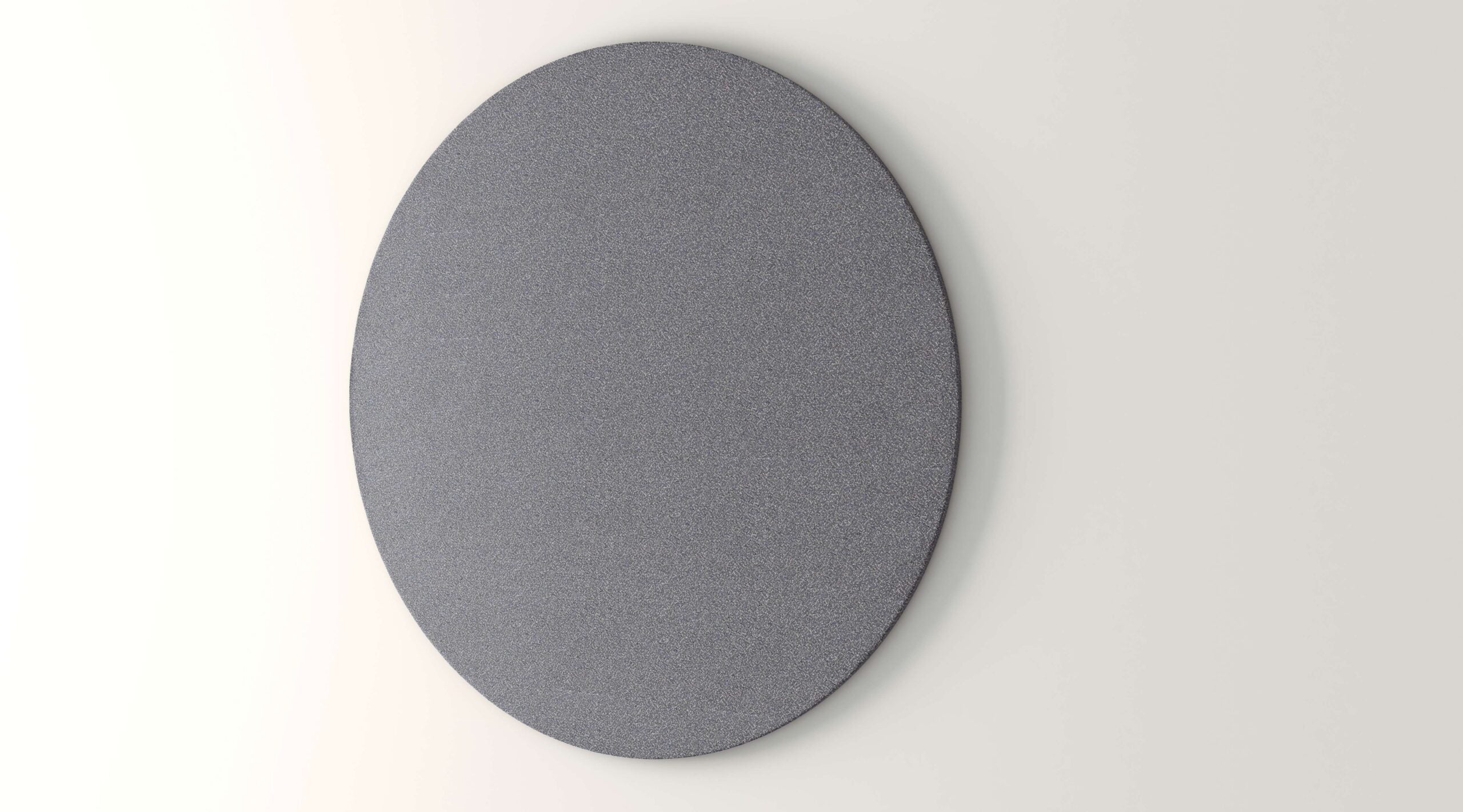 OBEX circular acoustical fabric tack board mounted on an office wall