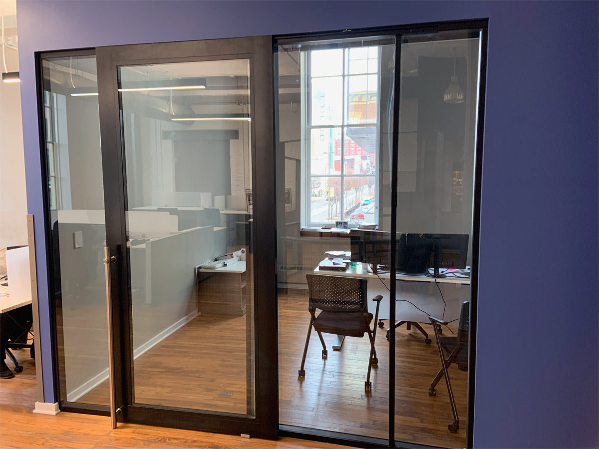 NxtWall FLEX black-frame glass private office with sliding door