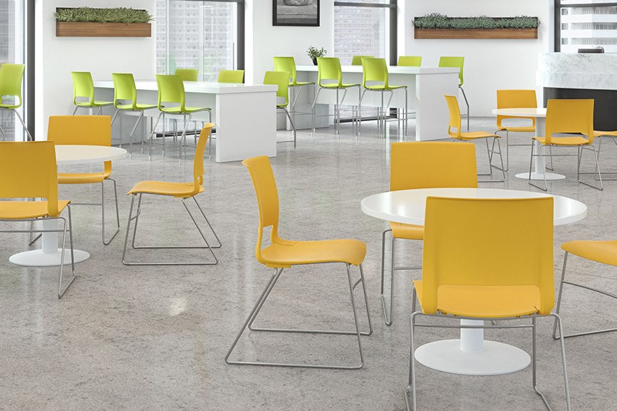 9to5 Vox polypropylene stacking chairs in a cafeteria